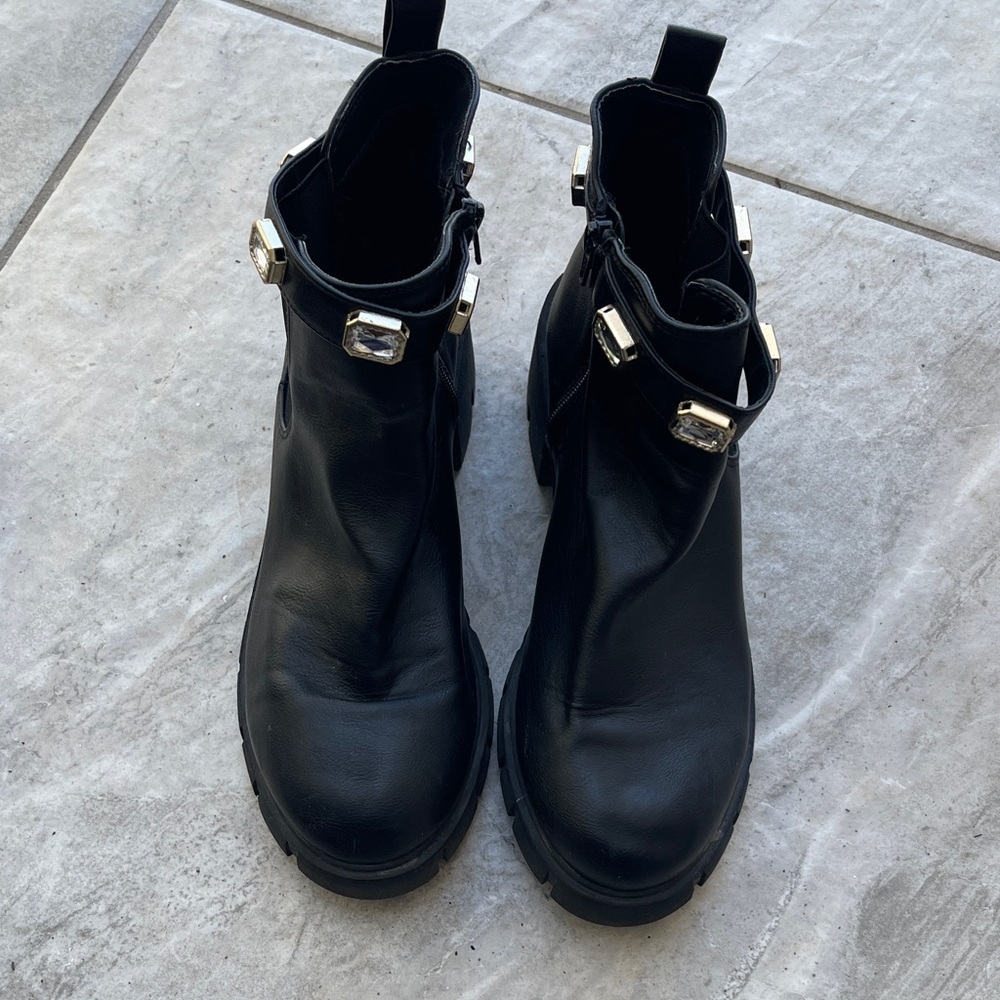 Chic Black Ankle Boots with Gold Accents